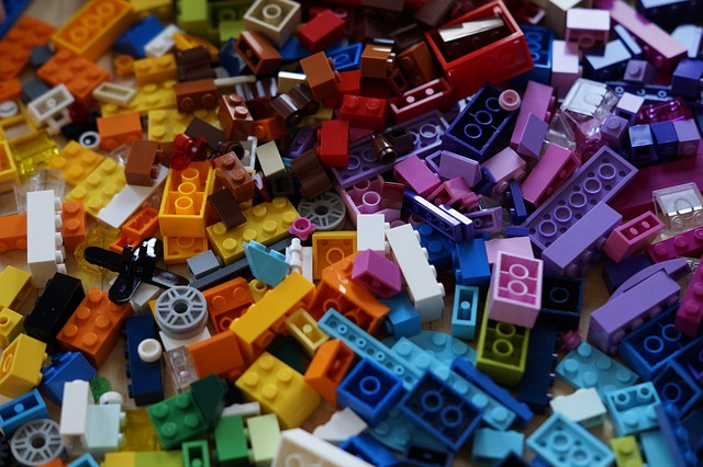 A chaotic pile of multicolored Lego blocks